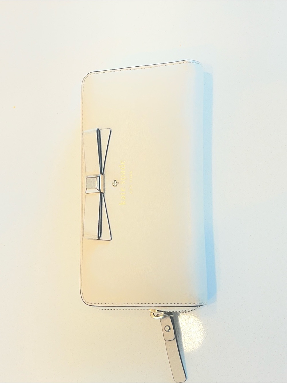kate spade Cream Bow Zip Wallet with Wrist Strap
